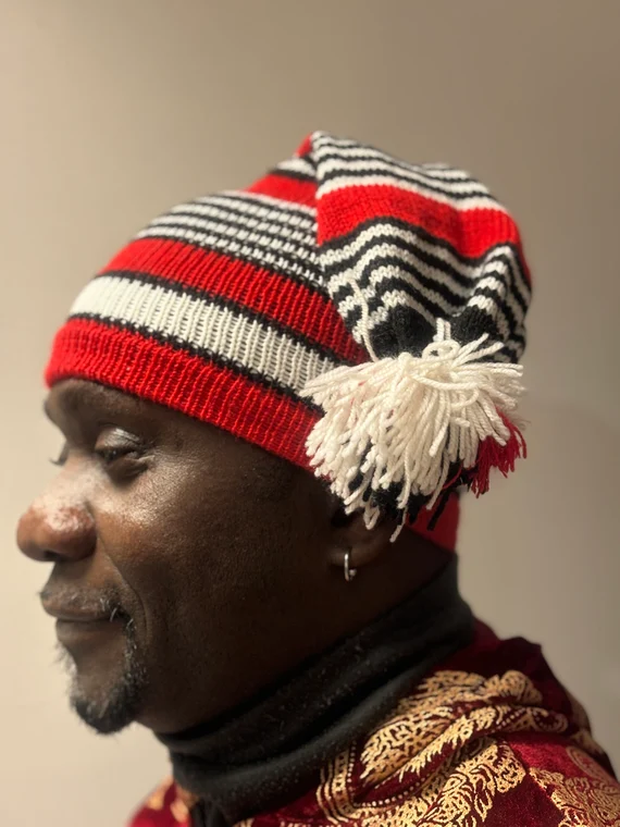red, black and white striped okpu agu hat